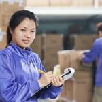 two chinese workers in warehouse